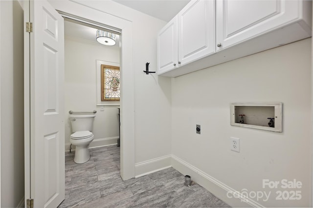 clothes washing area with washer hookup, hookup for an electric dryer, cabinet space, baseboards, and light wood-style floors