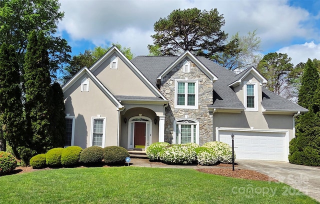 1253 Iverleigh Trl, Charlotte, NC 28270 - traditional home featuring stucco siding, stone siding, a front yard, concrete driveway, and a shingled roof