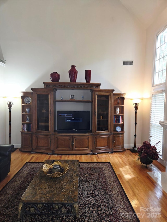 1253 Iverleigh Trl, Charlotte, NC 28270 - living room featuring high vaulted ceiling, light wood-style flooring, and baseboards