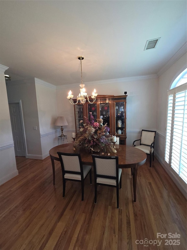 1253 Iverleigh Trl, Charlotte, NC 28270 - dining area with a chandelier, wood finished floors, and crown molding