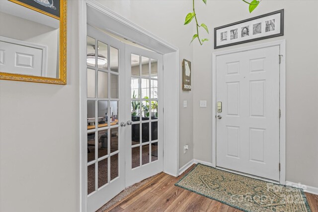 176 Pleasant Grove Ln, Mooresville, NC 28115 - entryway featuring french doors, wood finished floors, and baseboards