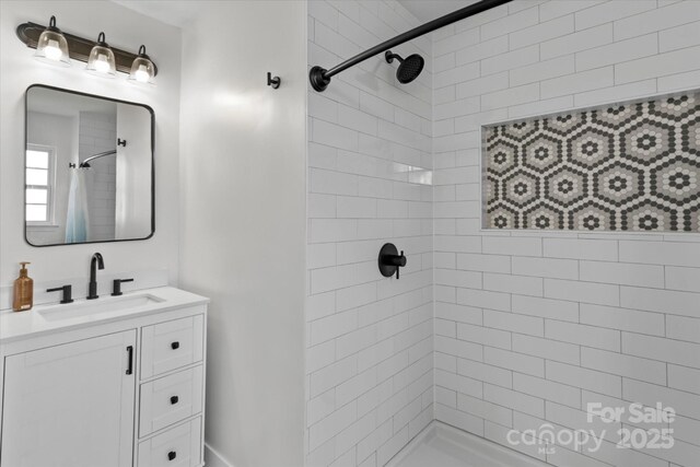 176 Pleasant Grove Ln, Mooresville, NC 28115 - bathroom featuring a tile shower and vanity