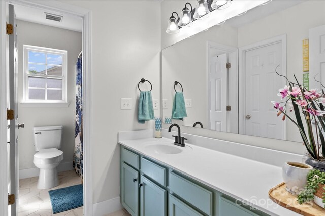176 Pleasant Grove Ln, Mooresville, NC 28115 - bathroom with vanity, baseboards, and toilet