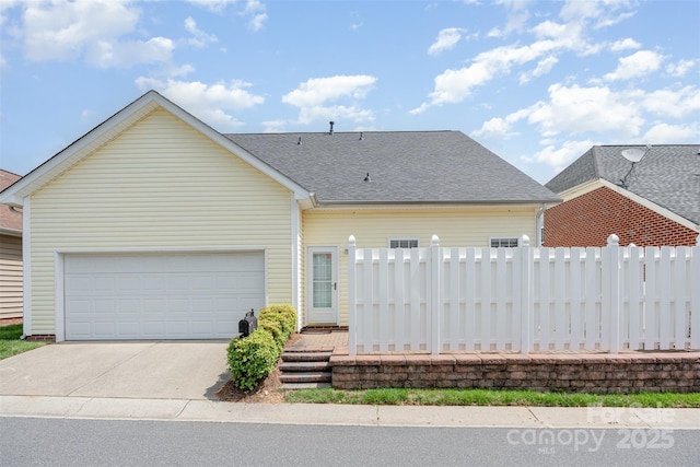 4504 Sages Ave, Indian Trail, NC 28079 - view of front of property featuring a garage, driveway, fence, and a shingled roof
