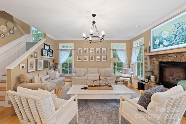 226 Duncan Estate Dr, Fletcher, NC 28732 - living area with a chandelier, wood finished floors, crown molding, a fireplace, and stairway