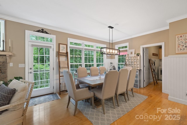 226 Duncan Estate Dr, Fletcher, NC 28732 - dining area featuring light wood finished floors, a chandelier, and ornamental molding
