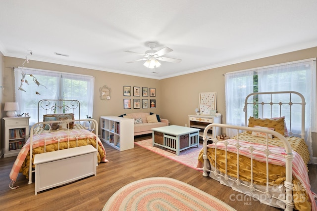 226 Duncan Estate Dr, Fletcher, NC 28732 - bedroom featuring crown molding, wood finished floors, and a ceiling fan