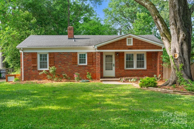 2953 Enfield Rd, Charlotte, NC 28205 - view of front facade with a front lawn, a chimney, brick siding, and roof with shingles