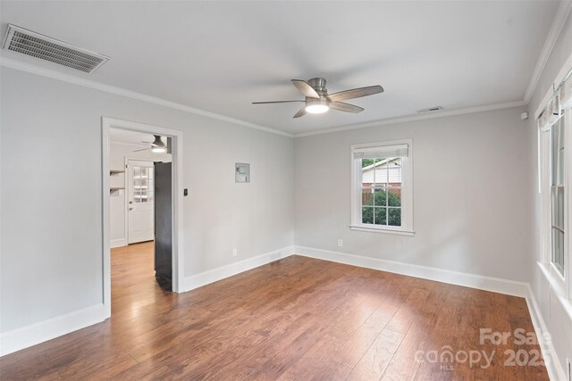 2953 Enfield Rd, Charlotte, NC 28205 - spare room featuring ceiling fan, wood finished floors, baseboards, and ornamental molding