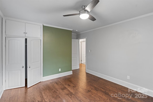 2953 Enfield Rd, Charlotte, NC 28205 - unfurnished bedroom featuring baseboards, ornamental molding, a closet, dark wood-style flooring, and ceiling fan