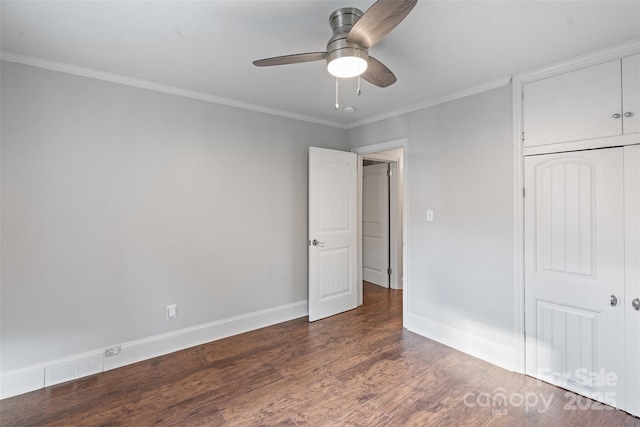 2953 Enfield Rd, Charlotte, NC 28205 - unfurnished bedroom with wood finished floors, ornamental molding, a closet, baseboards, and ceiling fan