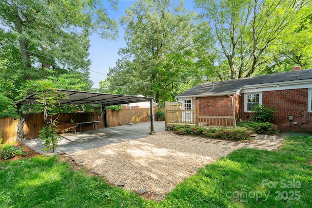 2953 Enfield Rd, Charlotte, NC 28205 - view of yard with a carport, fence, driveway, and a deck
