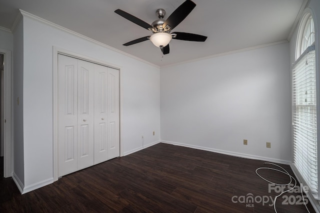1909 Wexford Ct, Gastonia, NC 28054 - unfurnished bedroom with dark wood-style flooring, baseboards, ornamental molding, a closet, and a ceiling fan