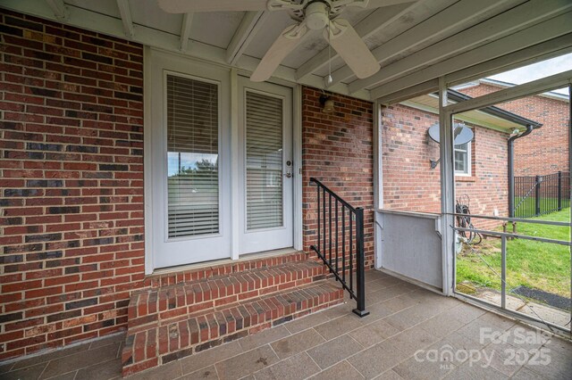 1909 Wexford Ct, Gastonia, NC 28054 - view of exterior entry featuring ceiling fan and brick siding