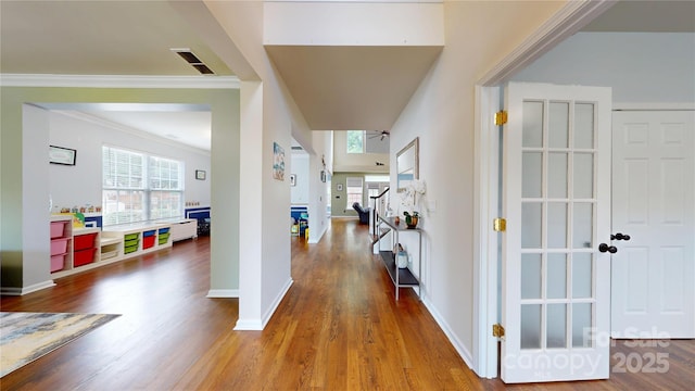 14615 Bridle Trace Ln, Pineville, NC 28134 - hall featuring healthy amount of natural light, wood finished floors, crown molding, and baseboards