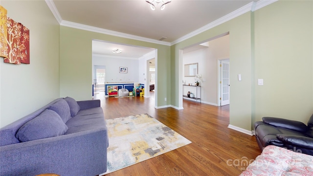 14615 Bridle Trace Ln, Pineville, NC 28134 - living area with wood finished floors, crown molding, and baseboards