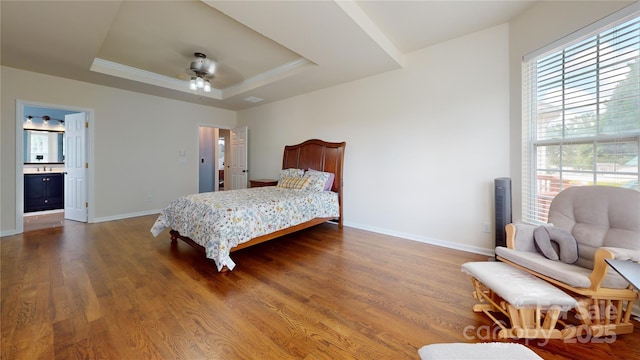 14615 Bridle Trace Ln, Pineville, NC 28134 - bedroom with wood finished floors, a raised ceiling, baseboards, a ceiling fan, and ensuite bath