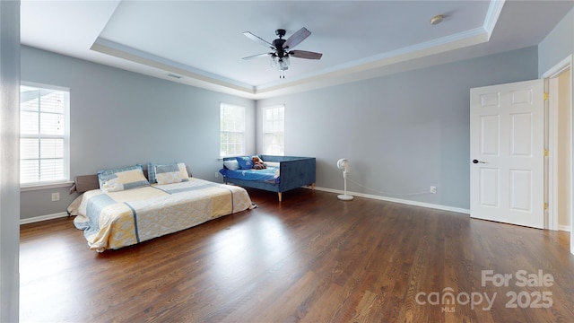 14615 Bridle Trace Ln, Pineville, NC 28134 - bedroom featuring a tray ceiling, multiple windows, wood finished floors, and ornamental molding