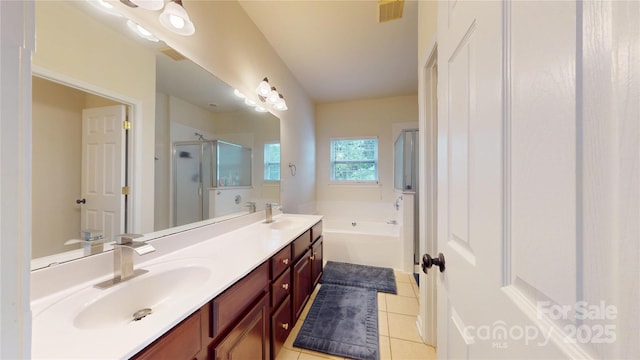 14615 Bridle Trace Ln, Pineville, NC 28134 - bathroom with tile patterned floors, a shower stall, a garden tub, and double vanity