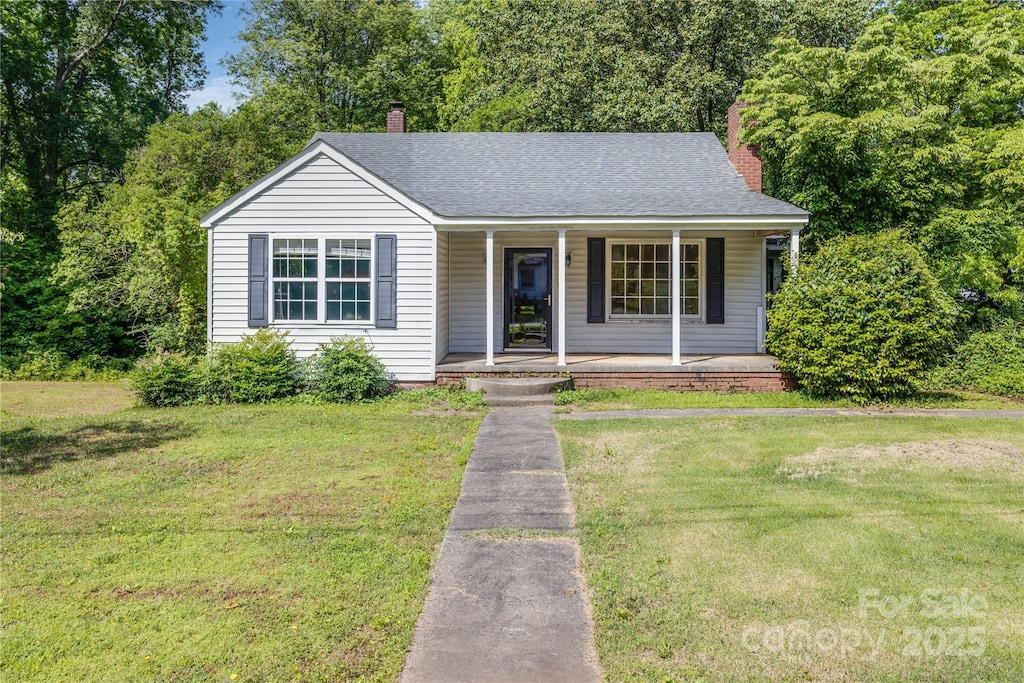 204 Blanche Ave, Belmont, NC 28012 - view of front of property featuring covered porch, a front lawn, and a chimney