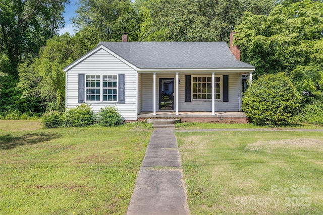 204 Blanche Ave, Belmont, NC 28012 - view of front of property featuring covered porch, a front lawn, and a chimney