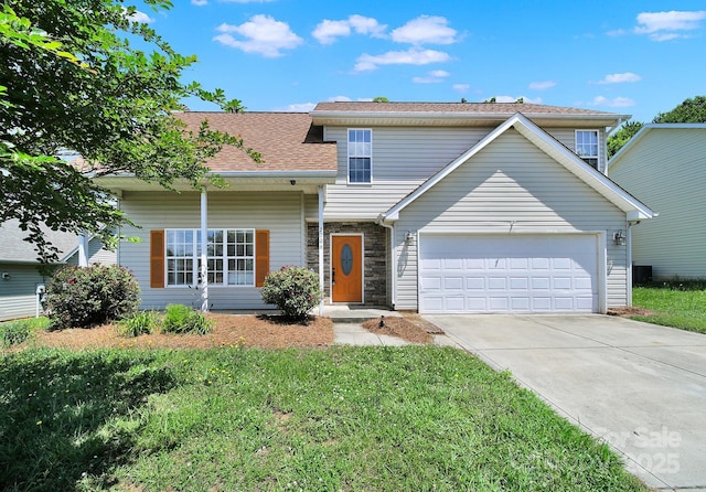 2706 Stagbuck Dr, Gastonia, NC 28052 - traditional home with an attached garage, concrete driveway, a front lawn, roof with shingles, and stone siding
