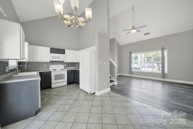 2706 Stagbuck Dr, Gastonia, NC 28052 - kitchen with white appliances, high vaulted ceiling, ceiling fan, a sink, and open floor plan