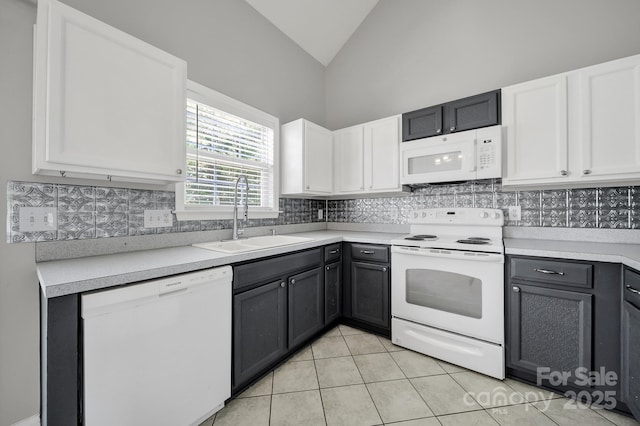 2706 Stagbuck Dr, Gastonia, NC 28052 - kitchen featuring white appliances, a sink, lofted ceiling, white cabinets, and tasteful backsplash