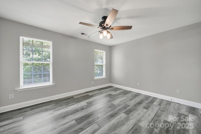 2706 Stagbuck Dr, Gastonia, NC 28052 - spare room with ceiling fan, wood finished floors, and baseboards