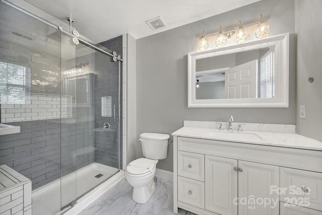 2706 Stagbuck Dr, Gastonia, NC 28052 - full bathroom featuring a shower stall, toilet, a ceiling fan, and vanity