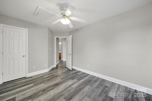2706 Stagbuck Dr, Gastonia, NC 28052 - unfurnished bedroom featuring attic access, wood finished floors, baseboards, and ceiling fan