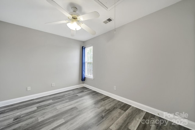 2706 Stagbuck Dr, Gastonia, NC 28052 - empty room with attic access, wood finished floors, baseboards, and ceiling fan