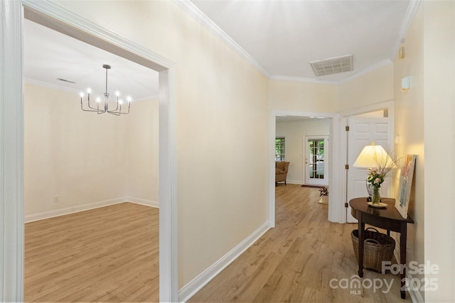 608 Camrose Cir NE, Concord, NC 28025 - corridor featuring ornamental molding, light wood-style floors, and a chandelier