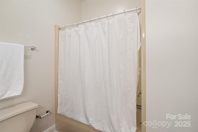 608 Camrose Cir NE, Concord, NC 28025 - bathroom with toilet and shower / bathtub combination with curtain