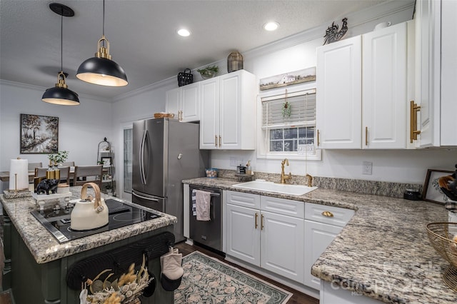 1575 Lewis Farm Rd, Kings Mountain, NC 28086 - kitchen featuring stainless steel appliances, a sink, white cabinetry, ornamental molding, and hanging light fixtures