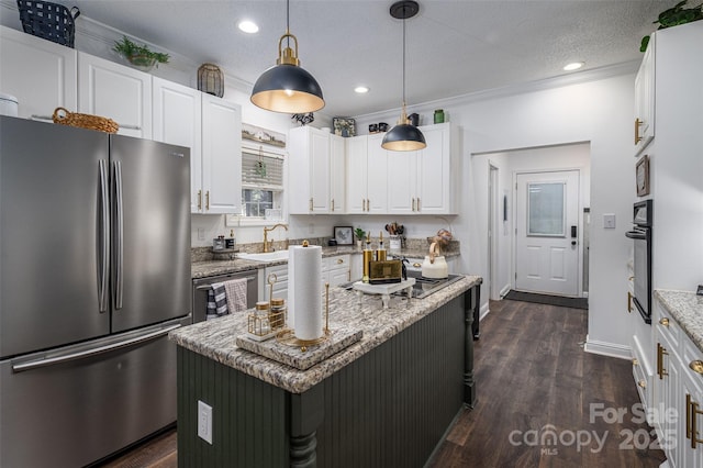 1575 Lewis Farm Rd, Kings Mountain, NC 28086 - kitchen with stainless steel appliances, white cabinets, dark wood-type flooring, light stone counters, and pendant lighting