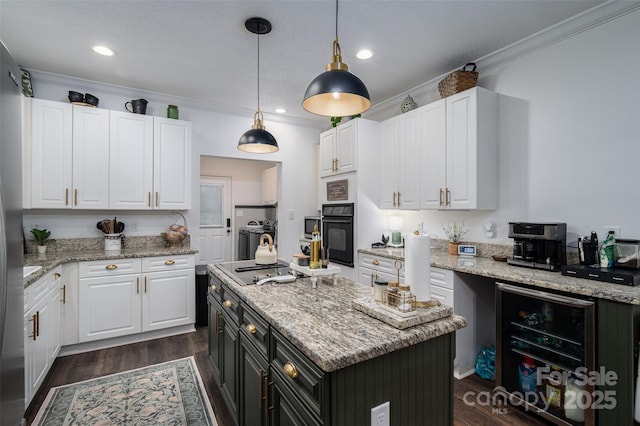 1575 Lewis Farm Rd, Kings Mountain, NC 28086 - kitchen with black oven, white cabinets, ornamental molding, light stone countertops, and pendant lighting