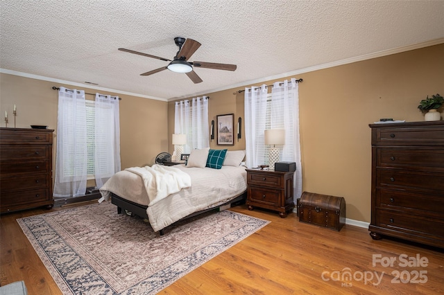 1575 Lewis Farm Rd, Kings Mountain, NC 28086 - bedroom with light wood-style flooring, a textured ceiling, crown molding, and a ceiling fan