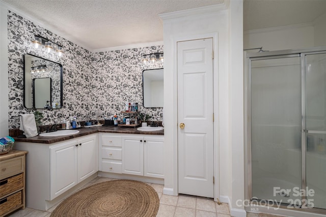 1575 Lewis Farm Rd, Kings Mountain, NC 28086 - bathroom featuring crown molding, a shower stall, double vanity, tile patterned floors, and a textured ceiling