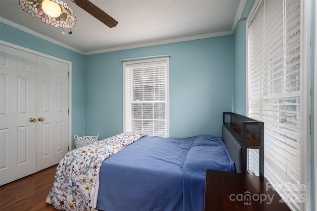 1575 Lewis Farm Rd, Kings Mountain, NC 28086 - bedroom featuring wood finished floors, crown molding, a closet, a ceiling fan, and a textured ceiling
