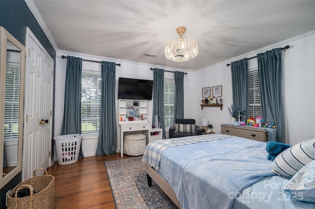 1575 Lewis Farm Rd, Kings Mountain, NC 28086 - bedroom with a chandelier, wood finished floors, a textured ceiling, and crown molding