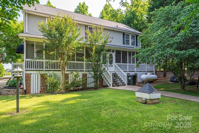 1575 Lewis Farm Rd, Kings Mountain, NC 28086 - rear view of house with a sunroom, stairway, a yard, and a shingled roof