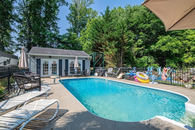 1575 Lewis Farm Rd, Kings Mountain, NC 28086 - view of swimming pool featuring a patio area, french doors, an outbuilding, and an exterior structure