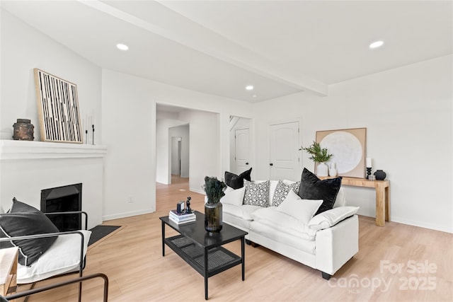 815 E Second Ave, Gastonia, NC 28054 - living room with light wood-style flooring, a fireplace with flush hearth, recessed lighting, and beam ceiling