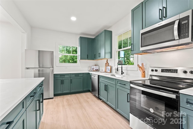 815 E Second Ave, Gastonia, NC 28054 - kitchen with appliances with stainless steel finishes, green cabinetry, healthy amount of natural light, light countertops, and recessed lighting