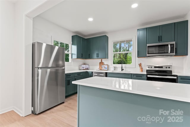 815 E Second Ave, Gastonia, NC 28054 - kitchen with stainless steel appliances, light countertops, light wood finished floors, and recessed lighting