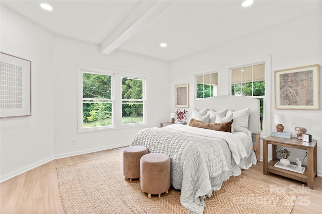 815 E Second Ave, Gastonia, NC 28054 - bedroom featuring multiple windows, beam ceiling, wood finished floors, and recessed lighting