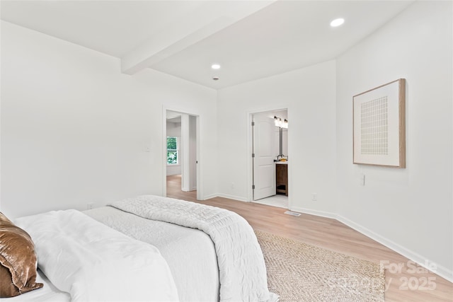 815 E Second Ave, Gastonia, NC 28054 - bedroom featuring light wood-style flooring, beam ceiling, recessed lighting, and connected bathroom
