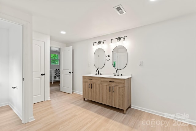 815 E Second Ave, Gastonia, NC 28054 - bathroom with double vanity, wood finished floors, and recessed lighting
