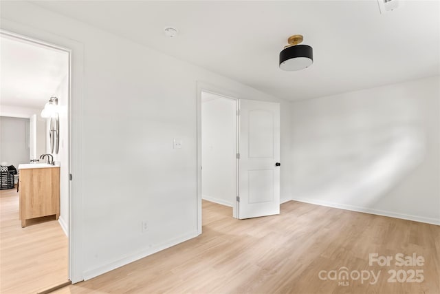 815 E Second Ave, Gastonia, NC 28054 - unfurnished bedroom featuring light wood-style flooring
